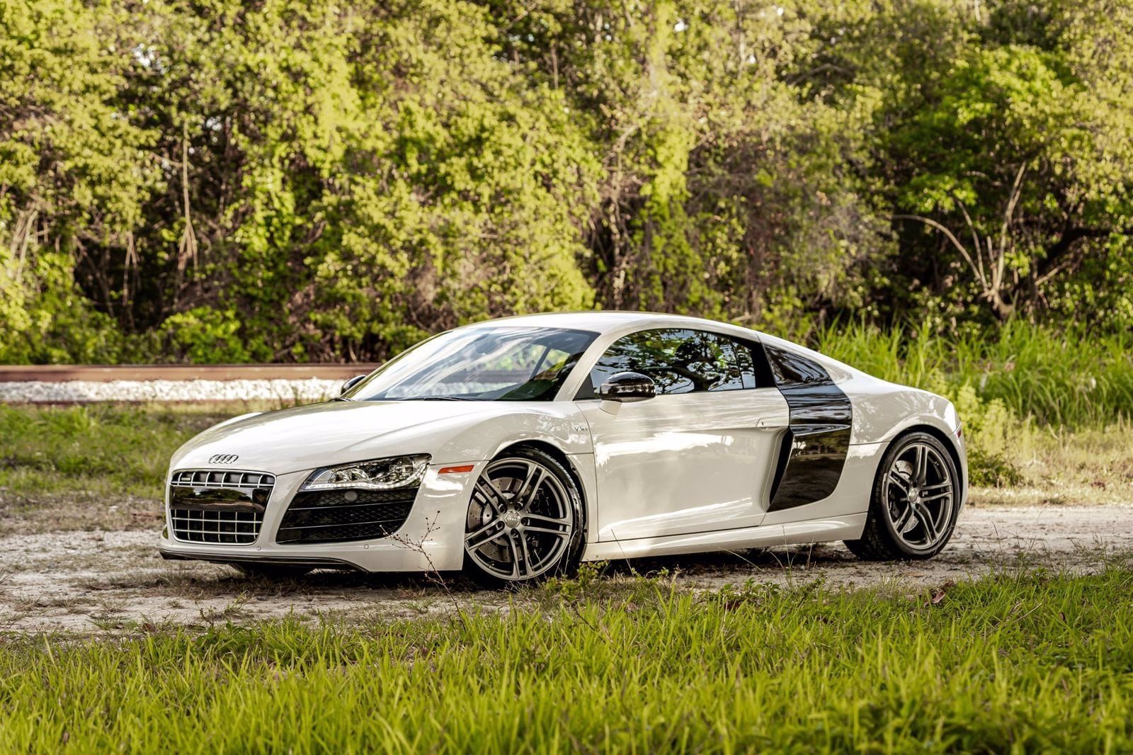 White Audi R8 photographed outside the shop